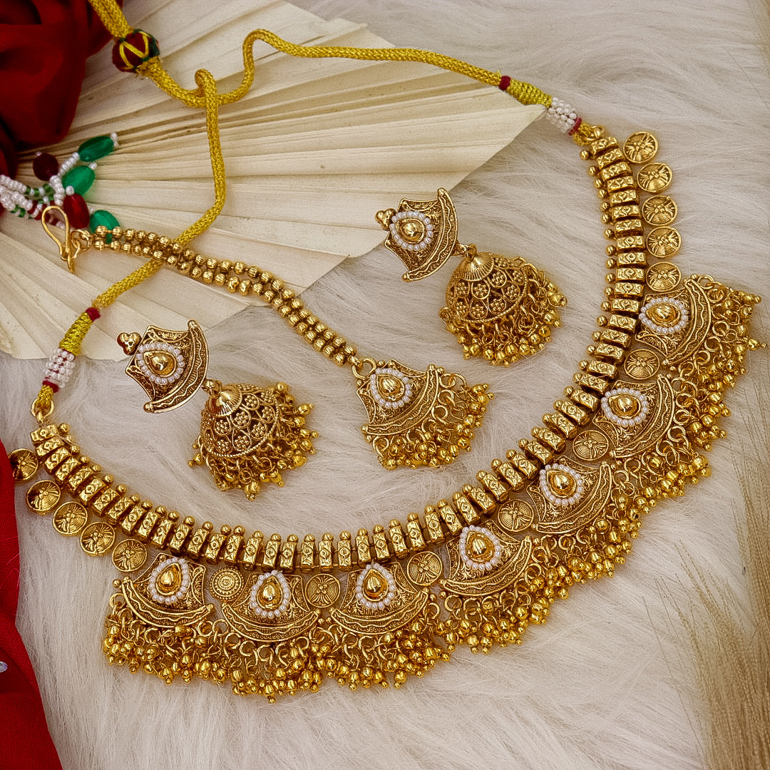 Yuma Trending Golden  Necklace With Earrings And Mangtika